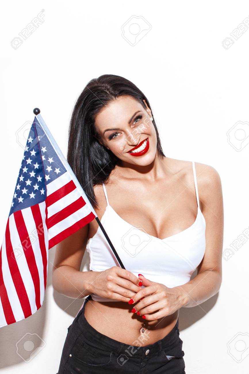 57890824-sexy-woman-with-big-tits-and-usa-flag-posing-at-wall-independence-day.jpg