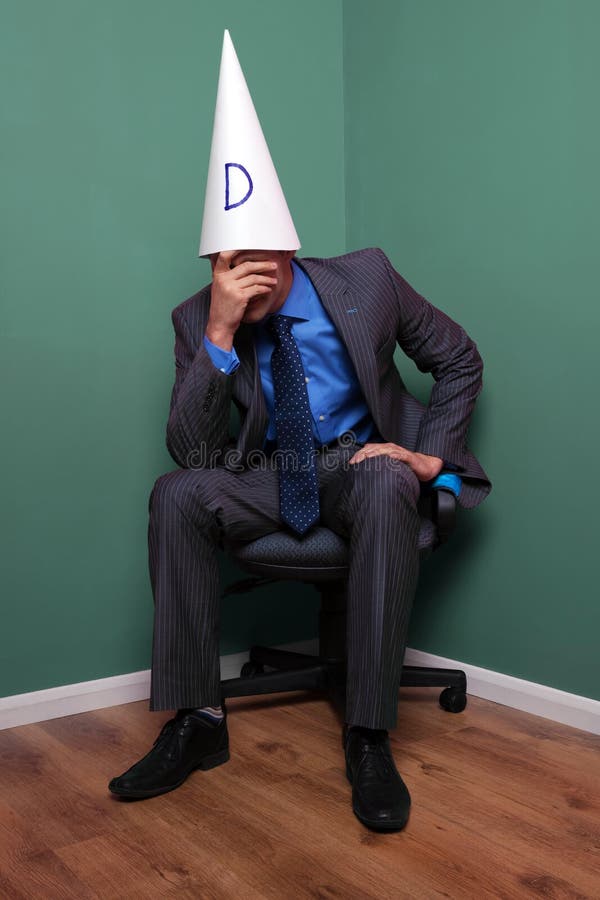 businessman-wearing-dunce-hat-9241483.jpg