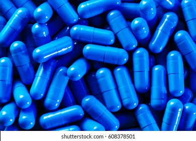 heap-vivid-blue-capsule-pills-260nw-608378501.jpg