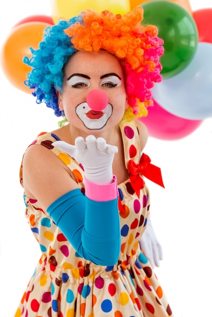 funny-playful-female-clown-colorful-wig-air-kissing_85574-10977.jpg