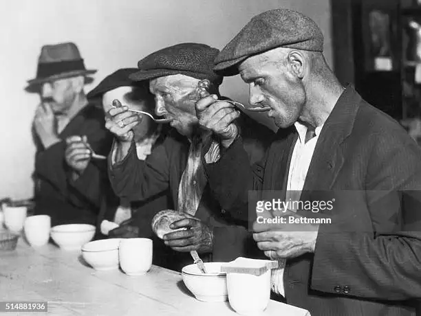 men-eating-soup-during-great-depression.webp