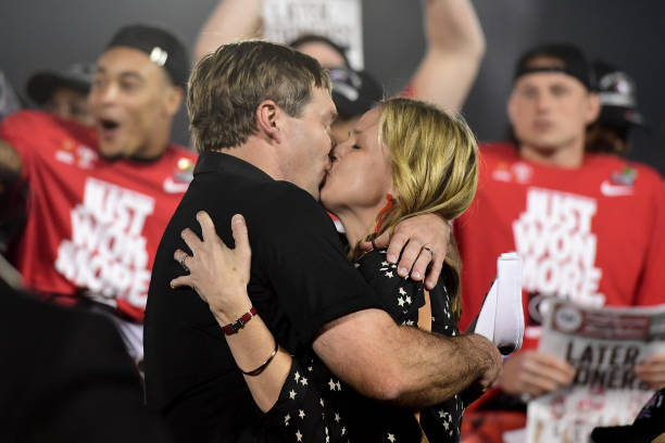 head-coach-kirby-smart-of-the-georgia-bulldogs-kisses-his-wife-mary-picture-id900375090