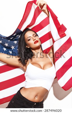 stock-photo-sexy-woman-holding-usa-flag-at-white-wall-fouth-of-july-287496020.jpg