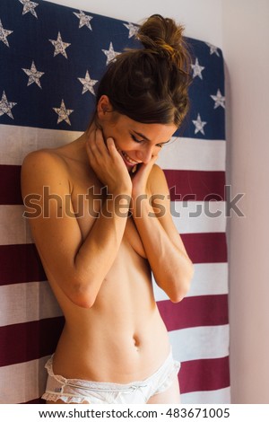 stock-photo-naked-sexy-young-woman-standing-against-american-flag-and-smiling-483671005.jpg