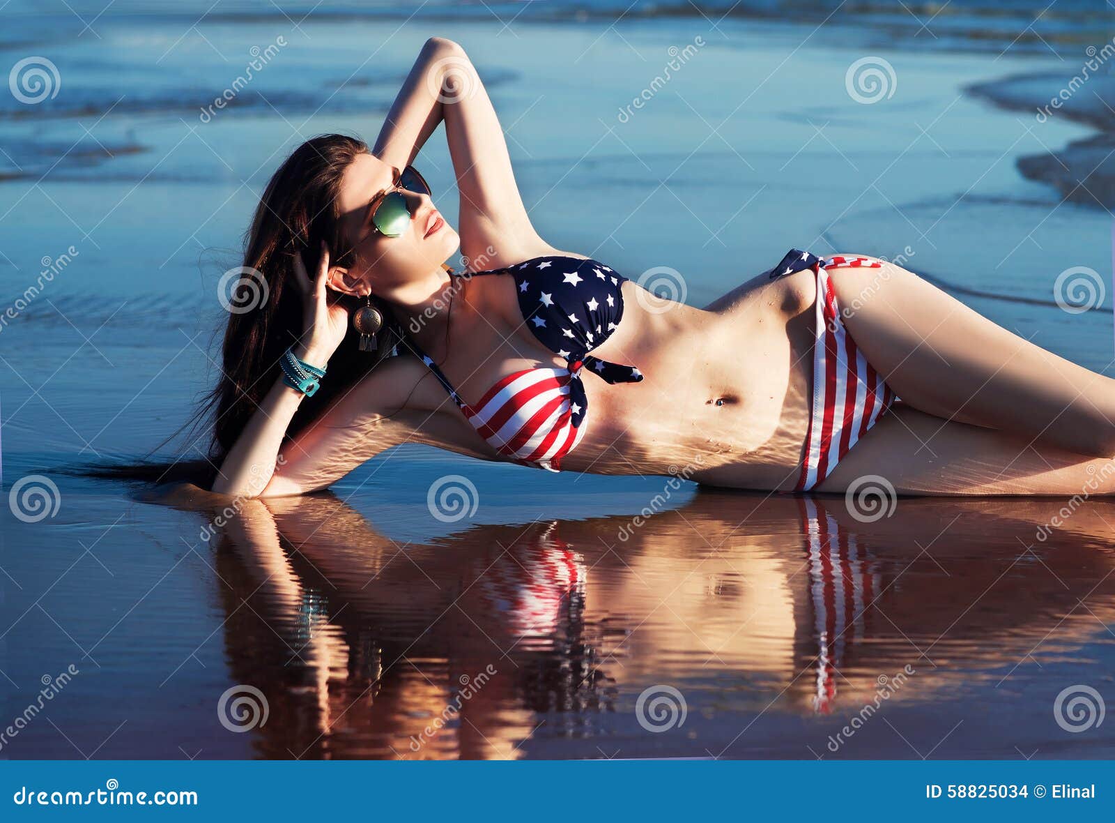 woman-american-flag-bikini-water-sea-waves-fashion-sunglasses-outdoor-58825034.jpg